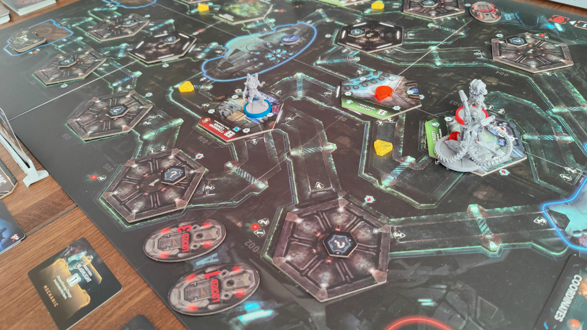 Shot showing a game of Nemesis in progress, with the ship partially explored and an Intruder on the field.