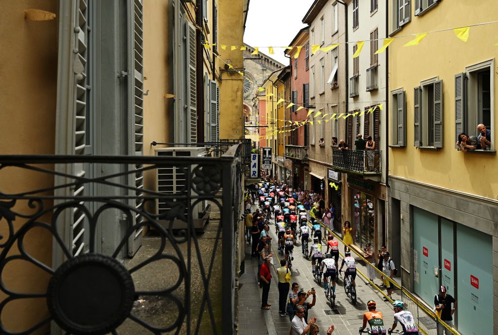 PIACENZA ITALY JULY 01 A general view of the peloton passing through a Piacenza village prior to the 111th Tour de France 2024 Stage 3 a 2308km stage from Piacenza to Torino UCIWT on July 01 2024 in Piacenza Italy Photo by Tim de WaeleGetty Images