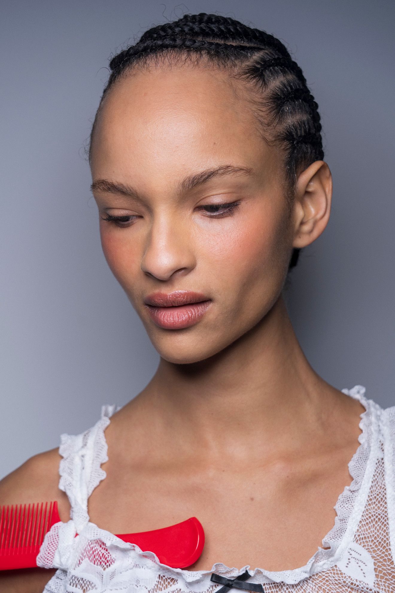 Various women with cornrow-braided hairstyles.