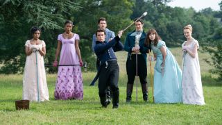 (L to R) Charithra Chandran as Edwina Sharma, Simone Ashley as Kate Sharma, Luke Newton as Colin Bridgerton, Luke Thompson as Benedict Bridgerton, Jonathan Bailey as Anthony Bridgerton hitting the ball, Claudia Jessie as Eloise Bridgerton, Phoebe Dyvenor as Daphne Basset playing Pall Mall.