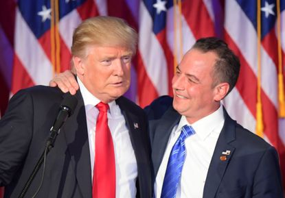 RNC chairman Reince Priebus hugs Donald Trump