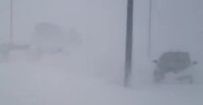 Blizzard in Amarillo whites out parking lot.