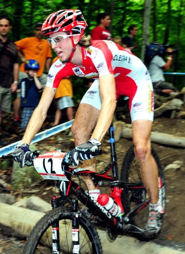 Katrin Leuymann descending over bumpy logs.