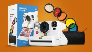 The Polaroid Now+ instant camera with its box and filters on an orange background