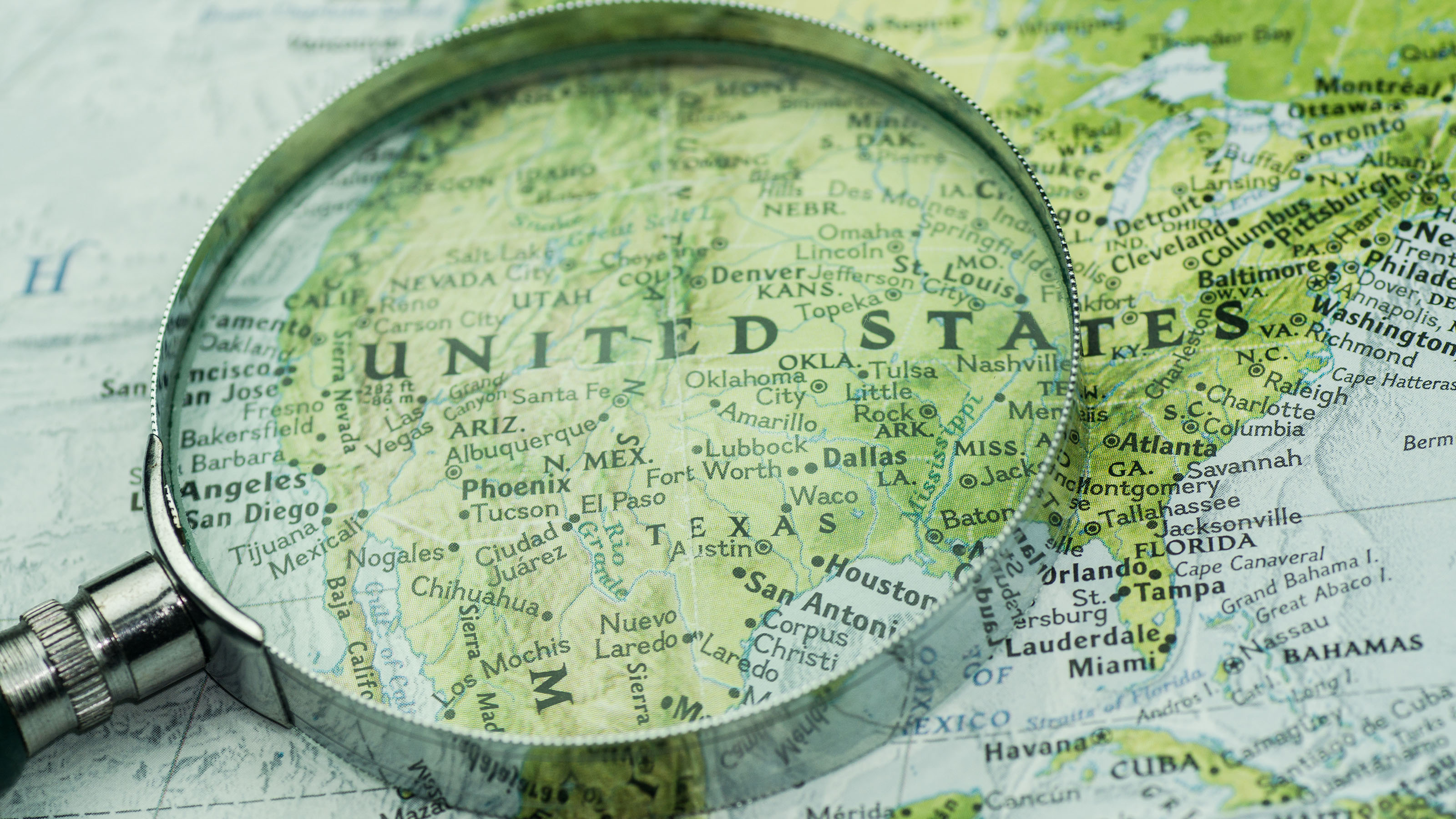 US map with magnifying glass