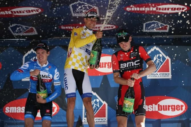 The top three from stage one spraying champagne on the podium