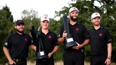 Legion XIII pose with the team trophy and Jon Rahm's individual title at LIV Golf UK