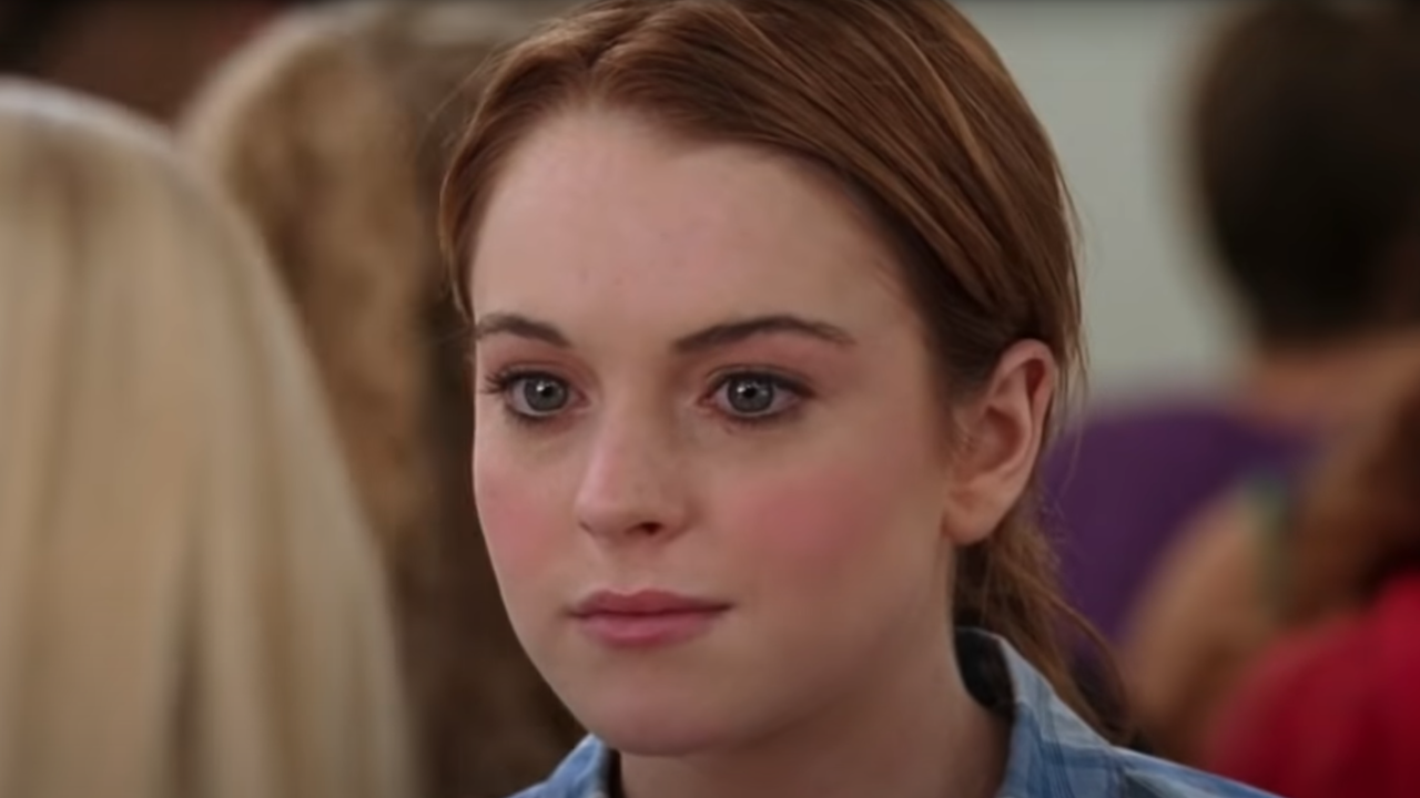 Cady Heron (Lindsay Lohan) sits in the lunchroom looking uncomfortable in a scene from the movie Mean Girls