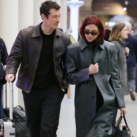 Callum Turner and Dua Lipa travel together with luggage in London