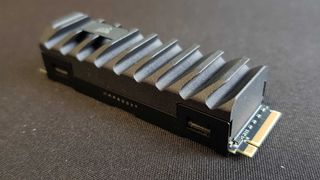 Corsair MP600 Pro XT SSD on a black mouse mat