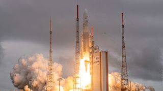 a white arianespace rocket lifts off from kourou, french guiana on dec. 25, 2021, carrying the james webb space telescope off earth