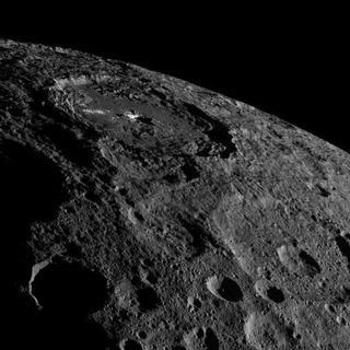 The strange bright spots of Occator Crater on the dwarf planet Ceres are unmistakable in this spectacular photo by NASA's Dawn spacecraft taken on Oct. 17, 2016 and released on Nov. 18 as Dawn moves into a higher orbit. 
