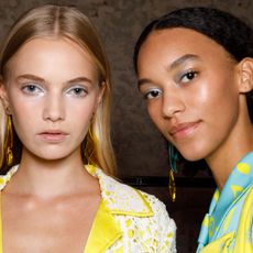 Models wearing eyeshadow pose in the backstage of the Hui fashion show during the Milan Fashion Week - Spring / Summer 2022 on September 26, 2021 in Milan, Italy. 