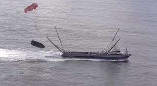 SpaceX's net-equipped boat, Mr. Steven, just misses catching a payload-fairing half during a recent test. This is a screengrab from a video SpaceX posted on Twitter on Jan. 29, 2019.