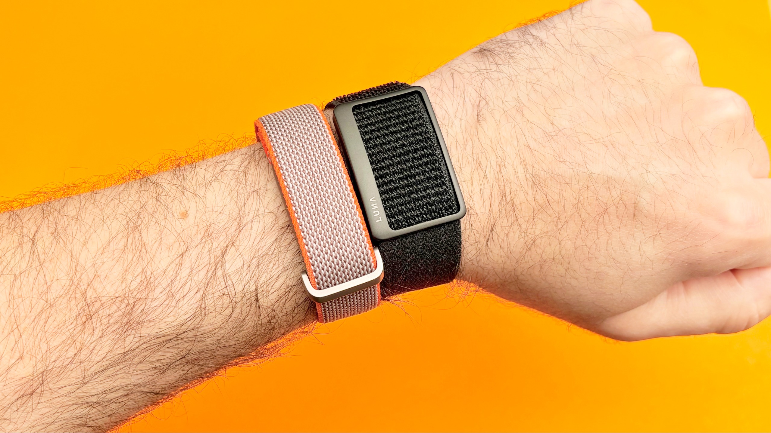 Close-up of the Luna Band next to the Fitbit Air