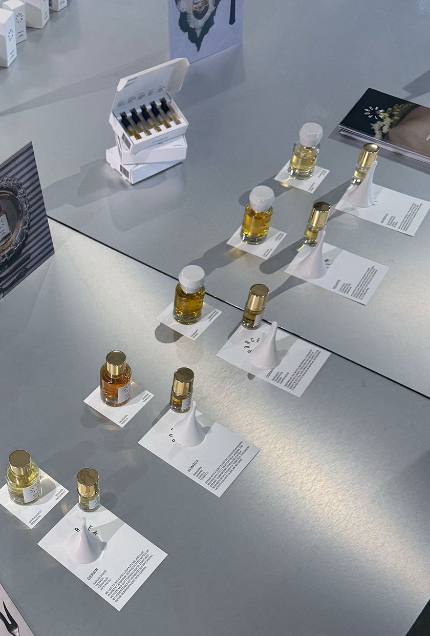 porcelain perfumery bottles on a metal table