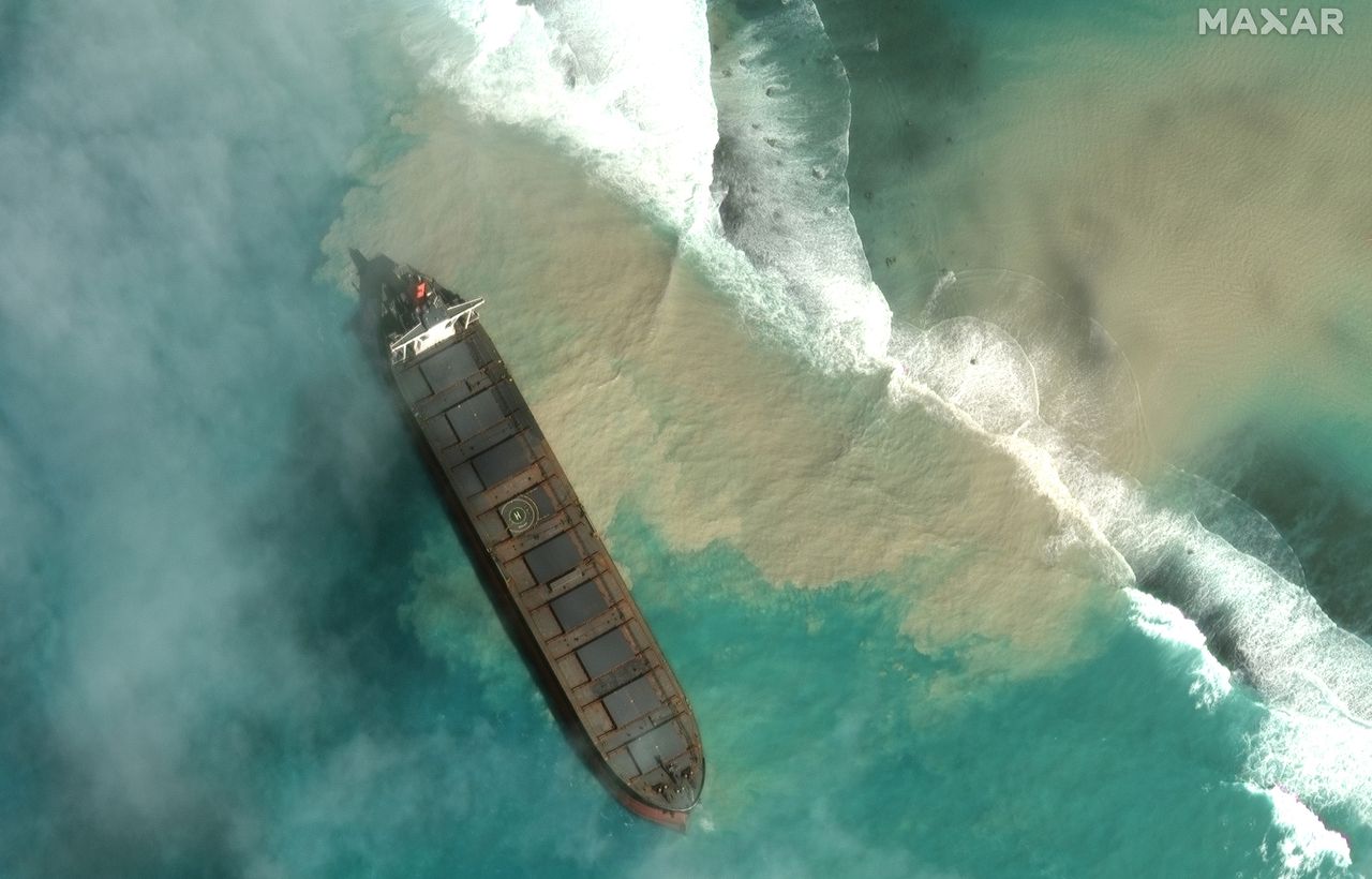 A bulk carrier ship, MV Wakashio, that recently ran aground off the southeast coast of Mauritius has been spilling oil into the sea, as seen in satellite images captured by Maxar Technologies on Aug. 7, 2020.