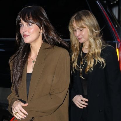 Dakota Johnson joins Jennifer Lawrence in New York with The Row bags in hand.