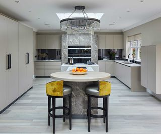 kitchen with large central island and statement pendant light overhead