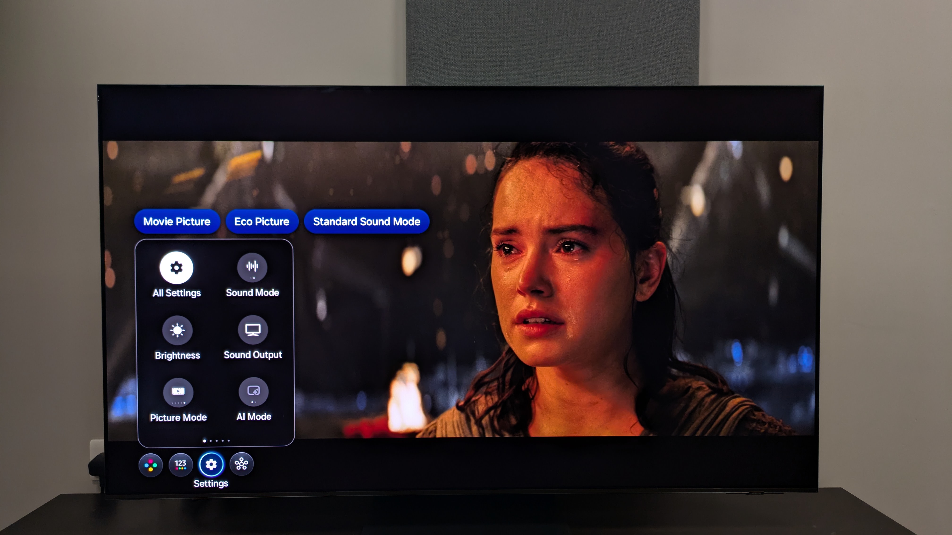 Samsung S95F with Stars Wars The Last Jedi on screen with settings menu overlayed