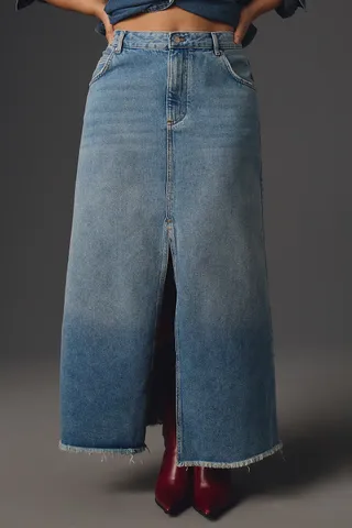 model wears the Madi Front-Slit Denim Skirt by Pilcro