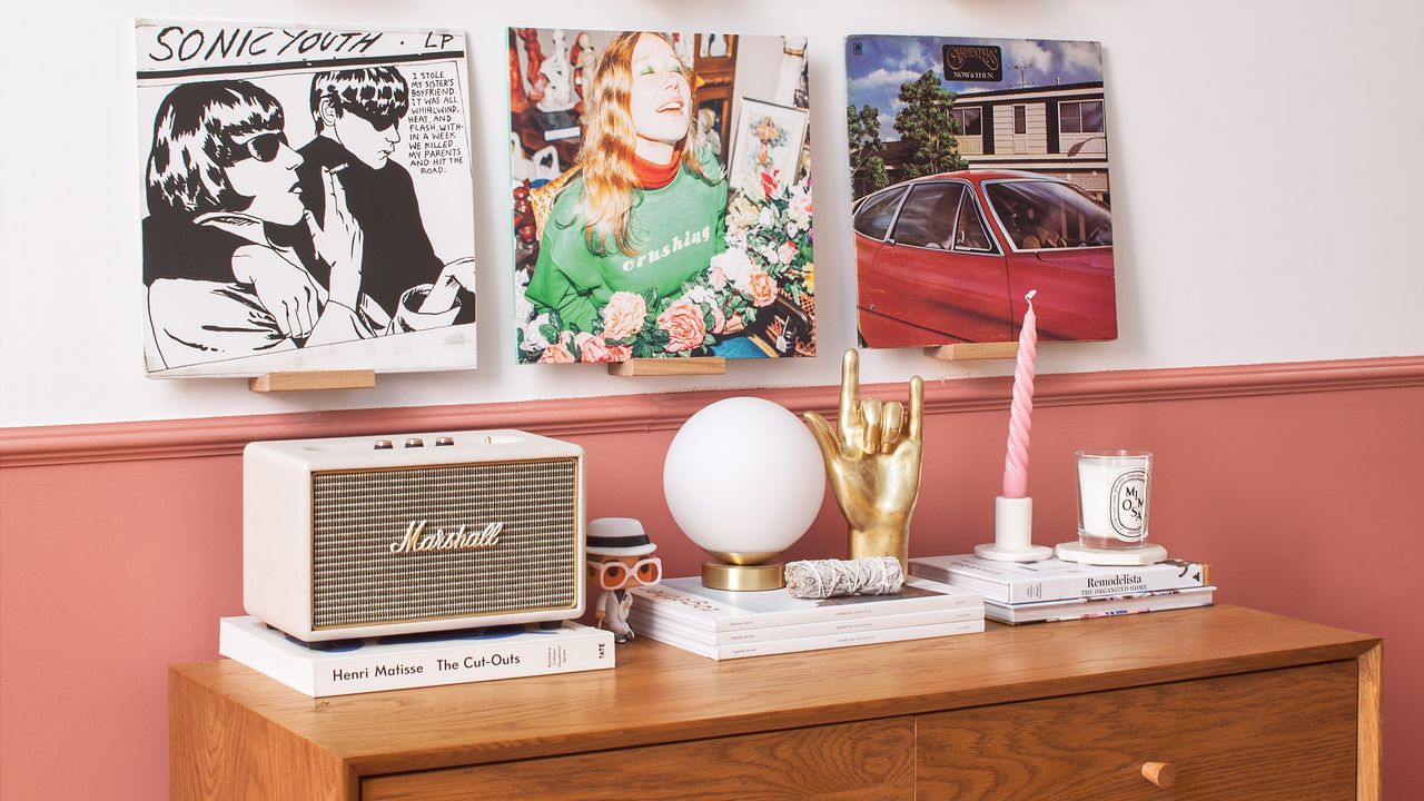 Kate Spiers living room with mid century sideboard and records on wall.