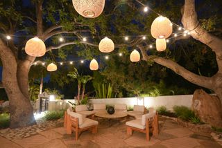 An outdoor area with string lanterns