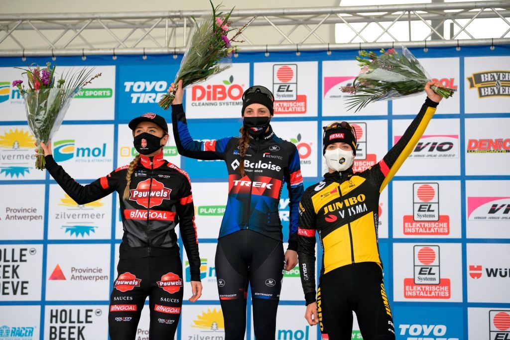 Bronze medallist Dutch Denise Betsema Gold medallist Dutch Lucinda Brand and and silver medalist Dutch Marianne Vos celebrate stand on the podium after the womens elite race of the Zilvermeercross cyclocross cycling event in Mol on January 16 2021 Photo by YORICK JANSENS various sources AFP Belgium OUT Photo by YORICK JANSENSBelgaAFP via Getty Images