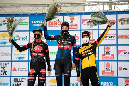 Bronze medallist Dutch Denise Betsema Gold medallist Dutch Lucinda Brand and and silver medalist Dutch Marianne Vos celebrate stand on the podium after the womens elite race of the Zilvermeercross cyclocross cycling event in Mol on January 16 2021 Photo by YORICK JANSENS various sources AFP Belgium OUT Photo by YORICK JANSENSBelgaAFP via Getty Images