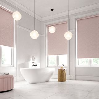 A bathroom with a marble effect floors and pale pink blinds