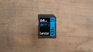 The Lexar 633X UHS-I SD, one of the best SD cards, on a wooden surface