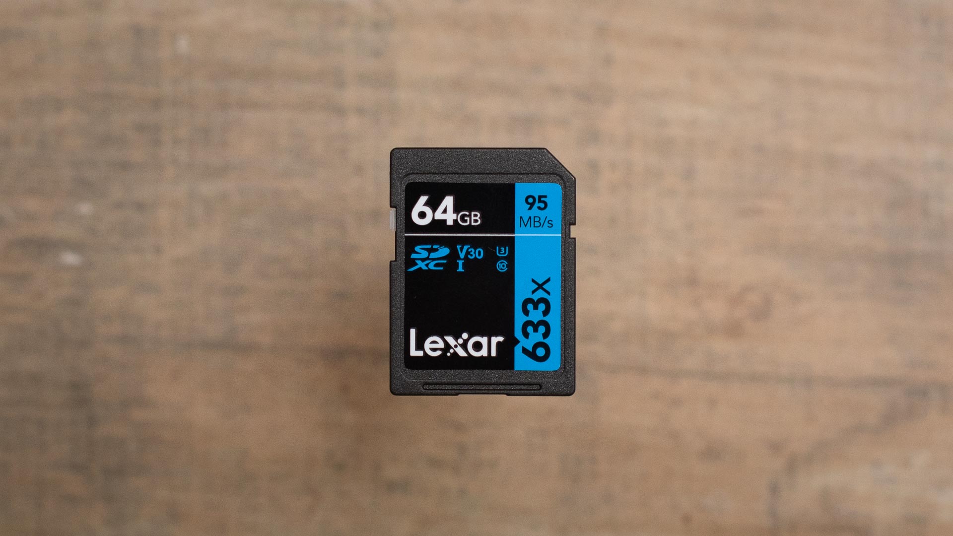 The Lexar 633X UHS-I SD card on a wooden table