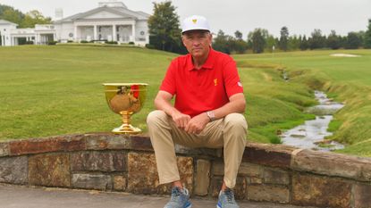 Davis Love III sits with The Presidents Cup at Quail Hollow Club in September 2021