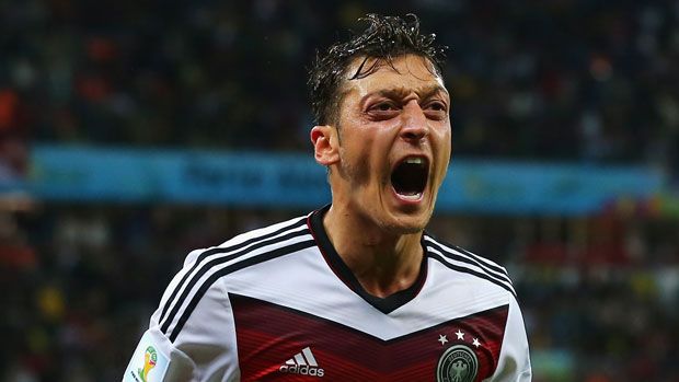 Mesut Ozil celebrates scoring the winner for Germany