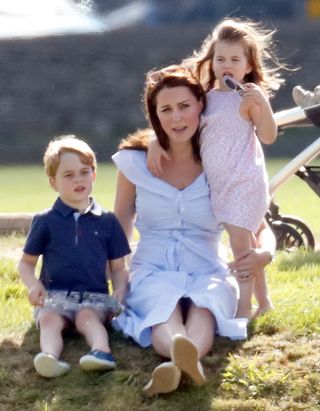 GLOUCESTER, UNITED KINGDOM - JUNE 10: (EMBARGOED FOR PUBLICATION IN UK NEWSPAPERS UNTIL 24 HOURS AFTER CREATE DATE AND TIME) Prince George of Cambridge, Catherine, Duchess of Cambridge and Princess Charlotte of Cambridge attend the Maserati Royal Charity Polo Trophy at the Beaufort Polo Club on June 10, 2018 in Gloucester, England. (Photo by Max Mumby/Indigo/Getty Images)