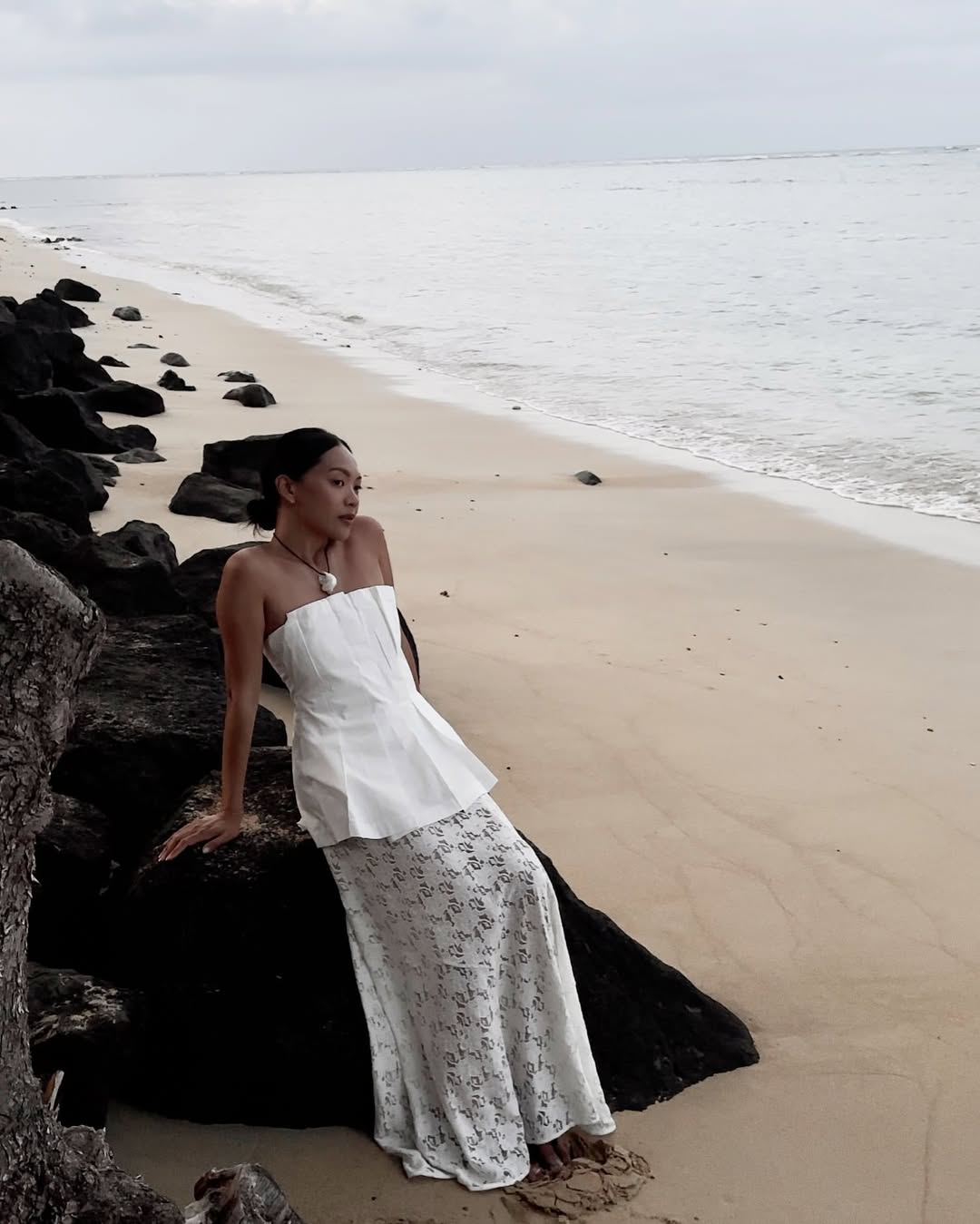 @dawn.tan wearing a lace skirt and strapless top