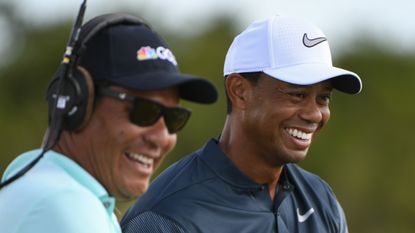 Tiger Woods and Notah Begay III smile