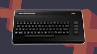 Top down view of The C64 Mini black edition with GamesRadar+ grey backdrop with orange plus symbols.