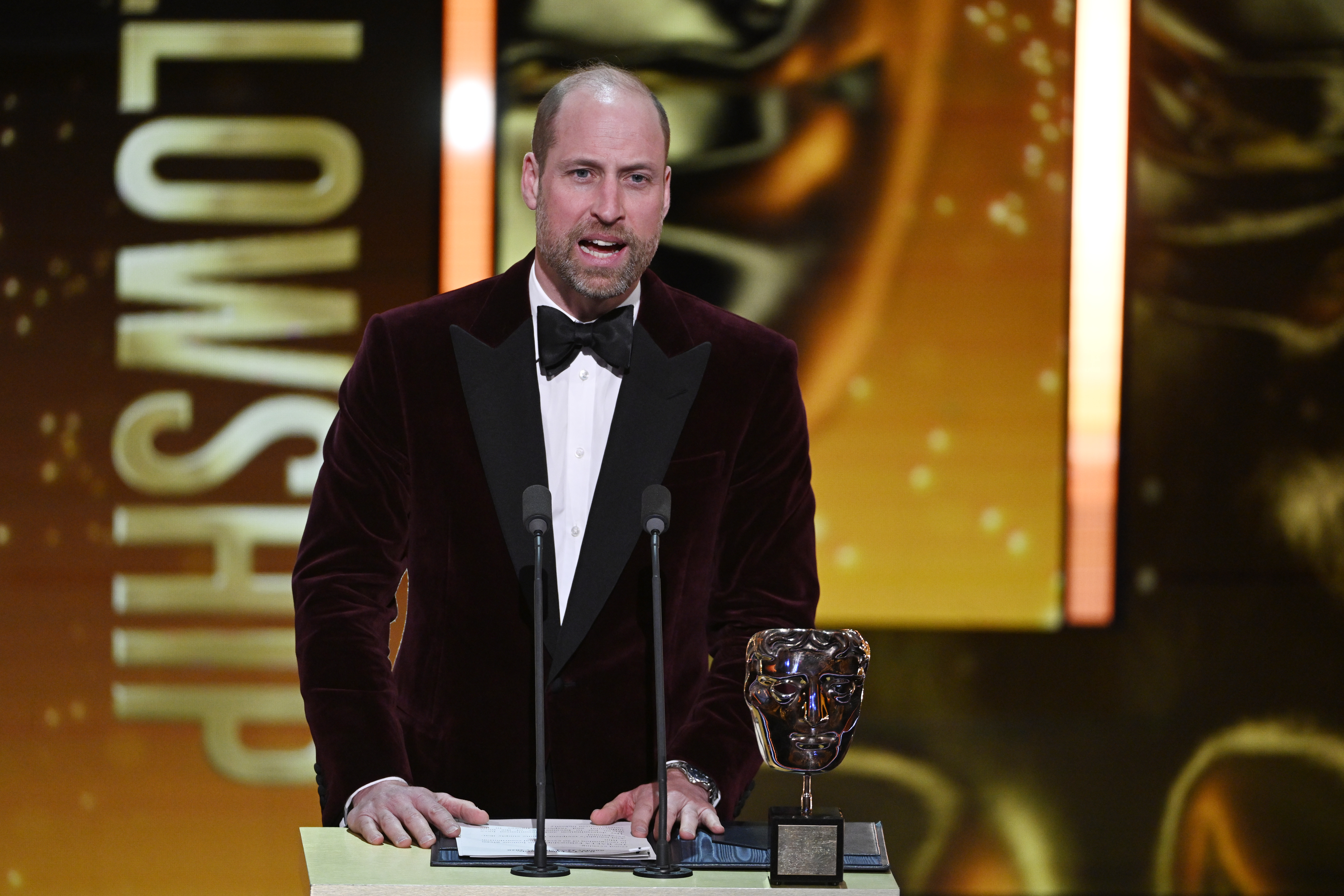 Prince William speaking in a mic on stage at the BAFTAs