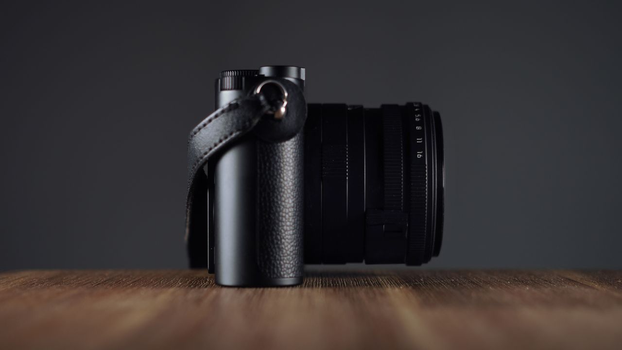 Leica Q3 Monochrom on a wooden surface