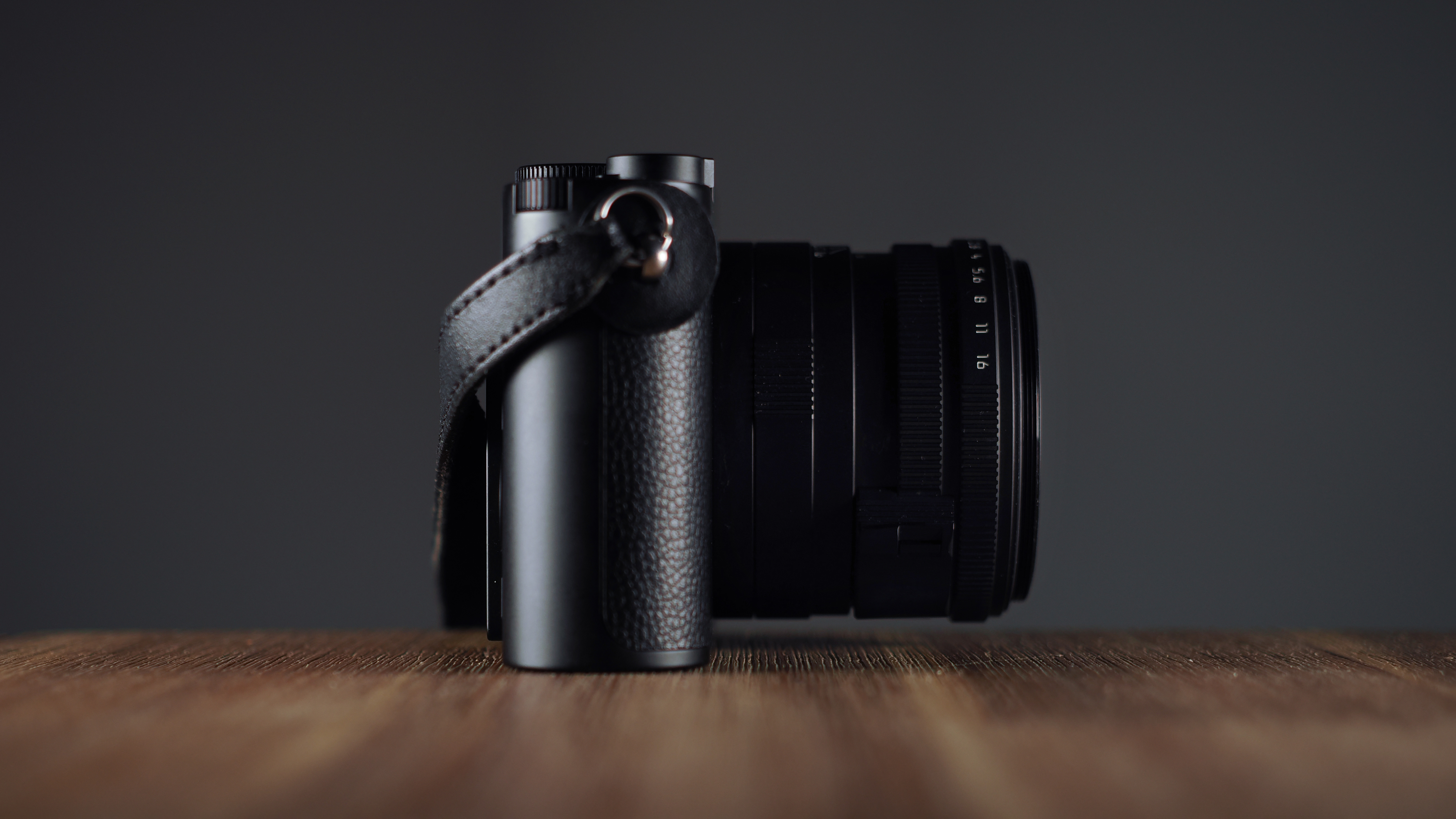 Leica Q3 Monochrom on a wooden surface