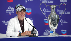 Nelly Korda speaks in her press conference with the trophy next to her