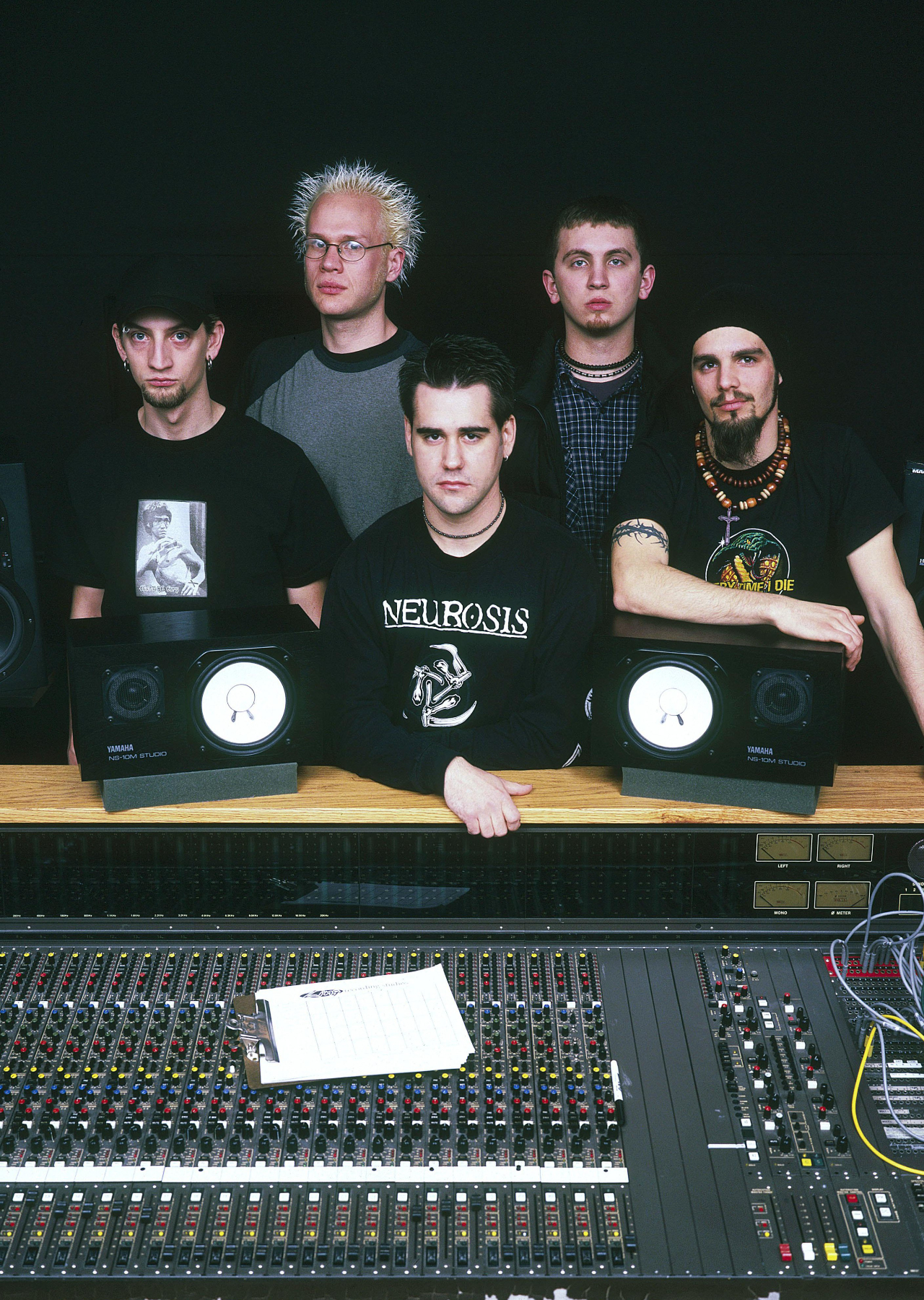 Killswitch Engage standing over a mixing desk in 2001
