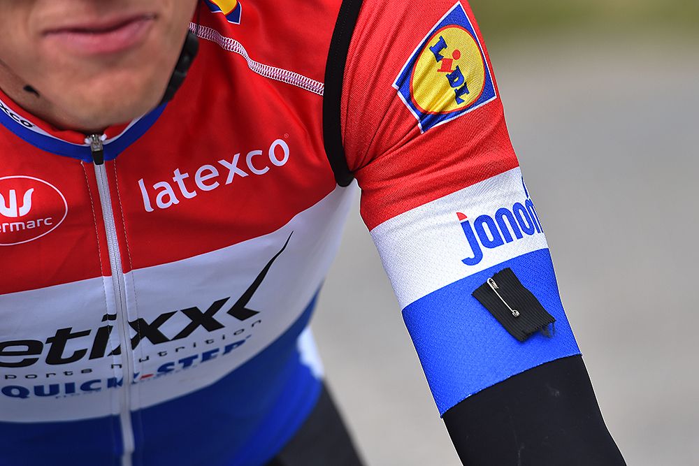 Etixx-QuickStep's Niki Terpstra at Dwars door Vlaanderen has a black ribbon symbolizing mourning for the bombings in Brussels