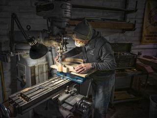 A photo showing Lloyd Baggs at work crafting the AEG-1 prototype.