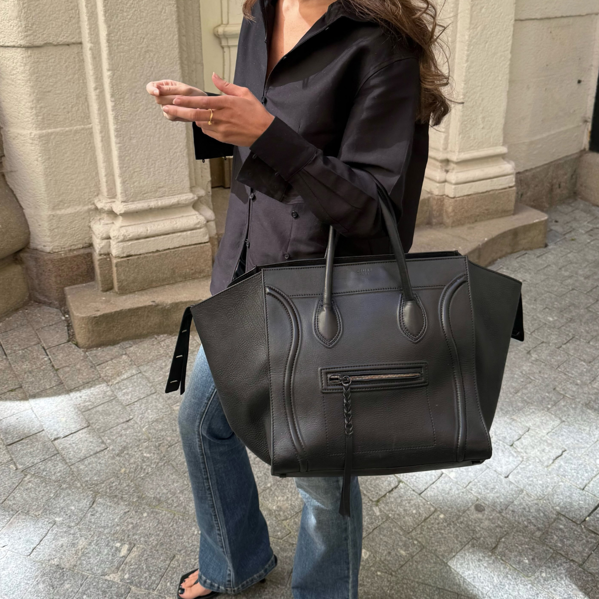 An image of a woman wearing low rise bootcut jeans trend 2026