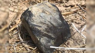 A close-up of a fragment of the fireball meteor found in Texas.