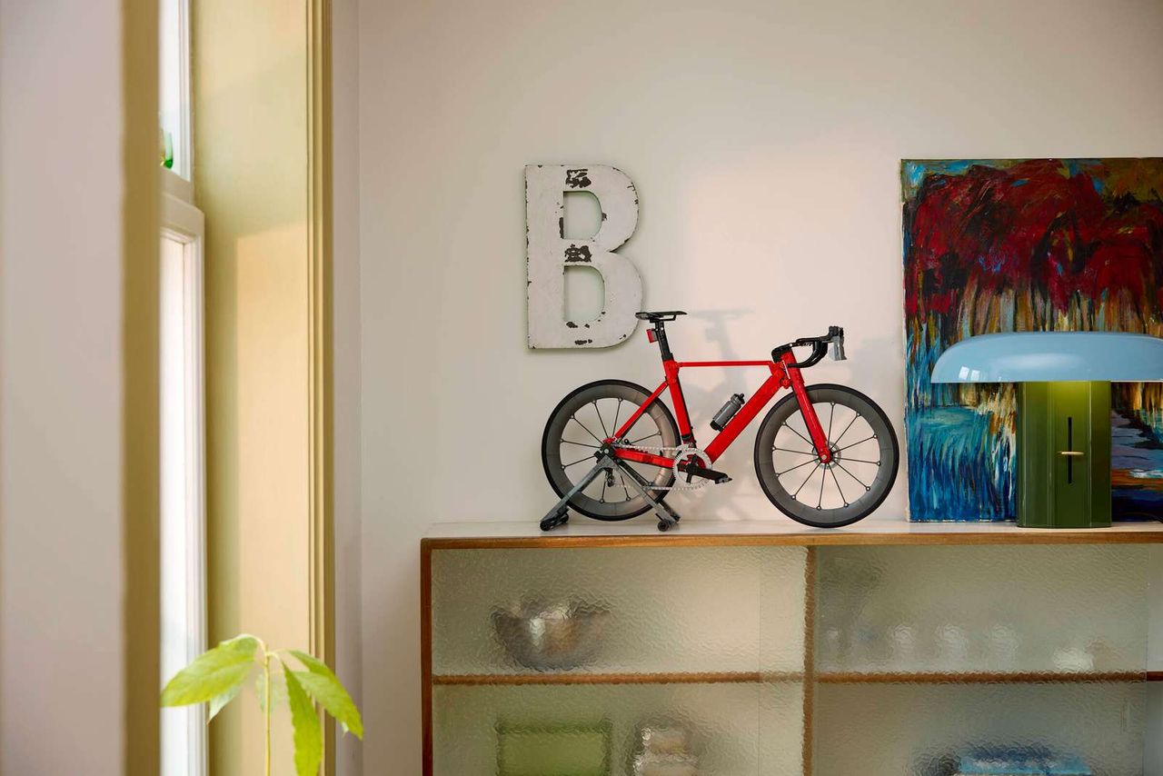 The Lego Icons Road Bike set on a shelf and showing the proportions of final build