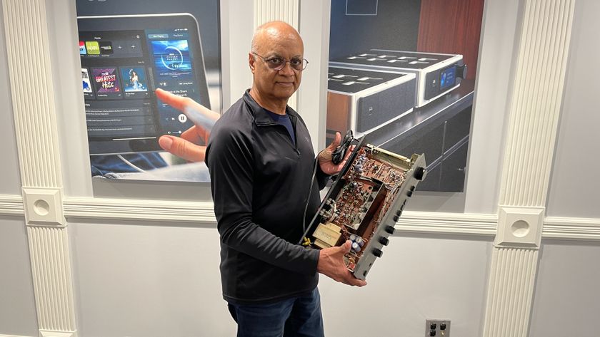 Taresh Vadgama holding an original NAD 3020 with lid taken off