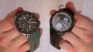 The OnePlus Watch 2 (left) and OnePlus Watch 3 (right) held in two hands, showing their default watch faces.